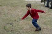 kid with hoop and stick.jpg (27134 bytes)